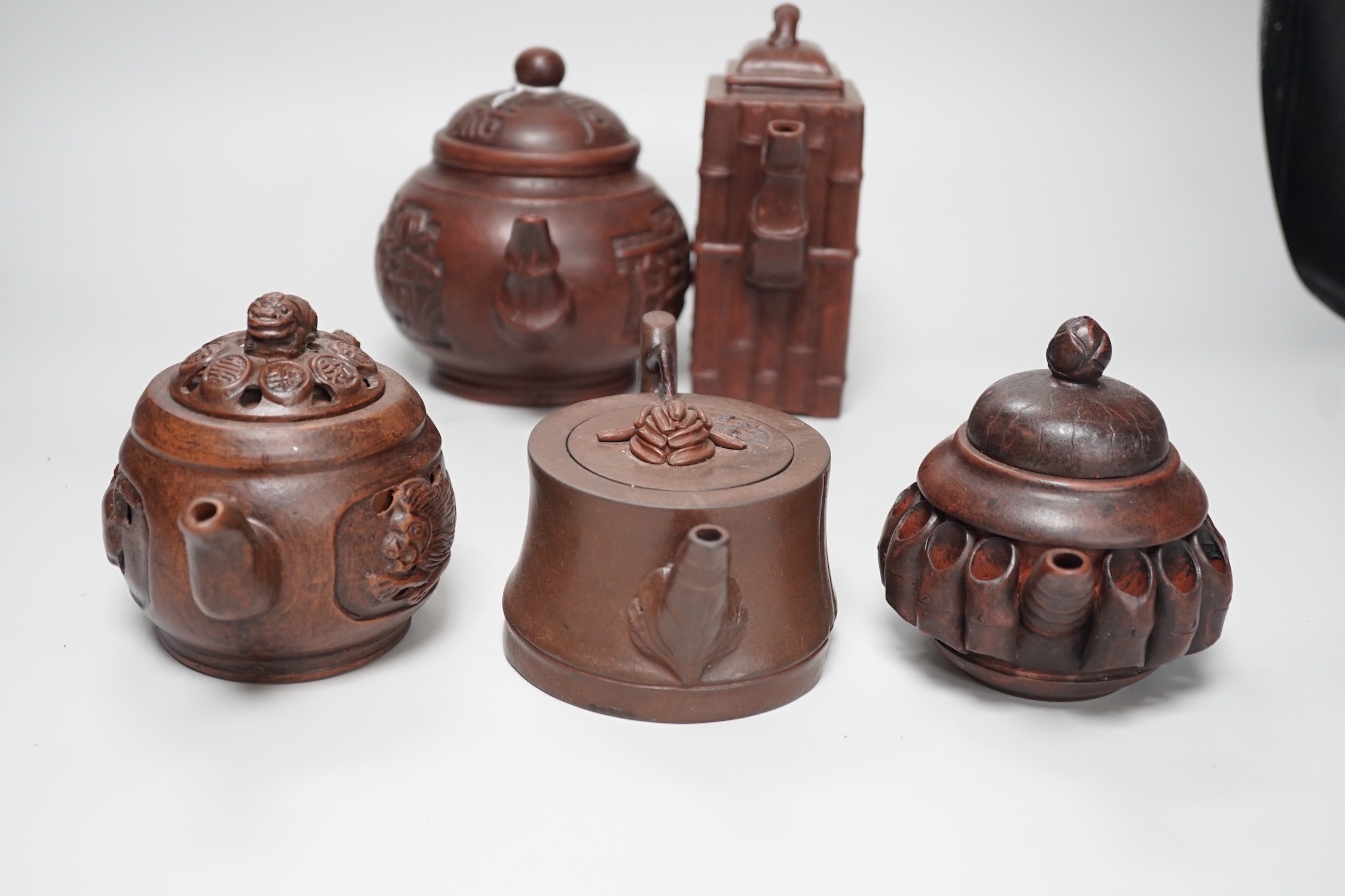 A collection of five Chinese Yixing teapots, tallest 6.5cms high